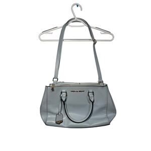 Christian Siriano teal purse quiet luxury clean girl preppy boho chic‎